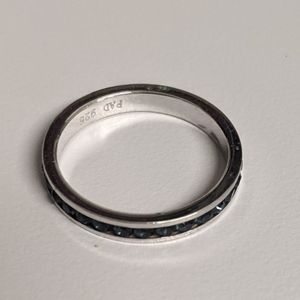 Sterling ring with blue stones all around